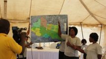 STDM Team member presents the boundary maps of the 7 villages. ©UN-HABITAT/John Gitau