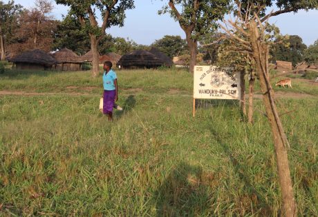 A young woman on her way to fetch water from Wanduku Primary School in Pajule sub county, Pader district in North Uganda Photo: UN Habitat/Grace Kibunja