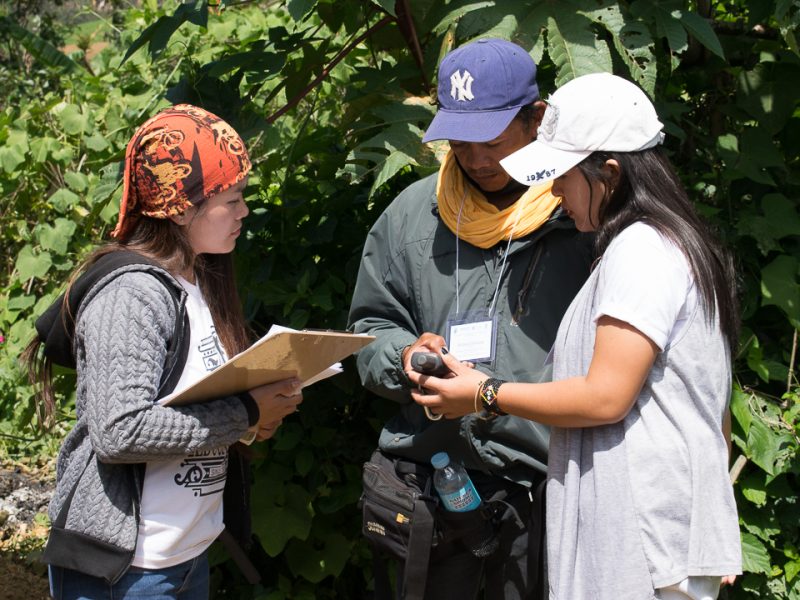 Maryjoy Tictic of MILALITTRA (left), Datu Richard of Dawatan of PTTA (middle), and Ms. Ms. Christine Joy Agudo of PTTA (right) demonstrates the GPS tracking system during the practical application of the survey.