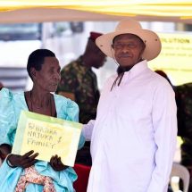 One of the beneficiaries receiving the certificate of customary ownership from the President of Uganda, H.E Yoweri Kaguta Museveni