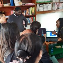 Pamoja Trust and the community in Mashimoni demonstrating the STDM to the Chinese delegation and how it is used to generate social and spatial data in the informal settlements within Kenya