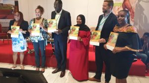 Land and GLTN Unit Leader Oumar Sylla (third from left) displaying copies of the GLTN Gender Strategy (2019-2030) with some of the GLTN partners who participated at the launch.