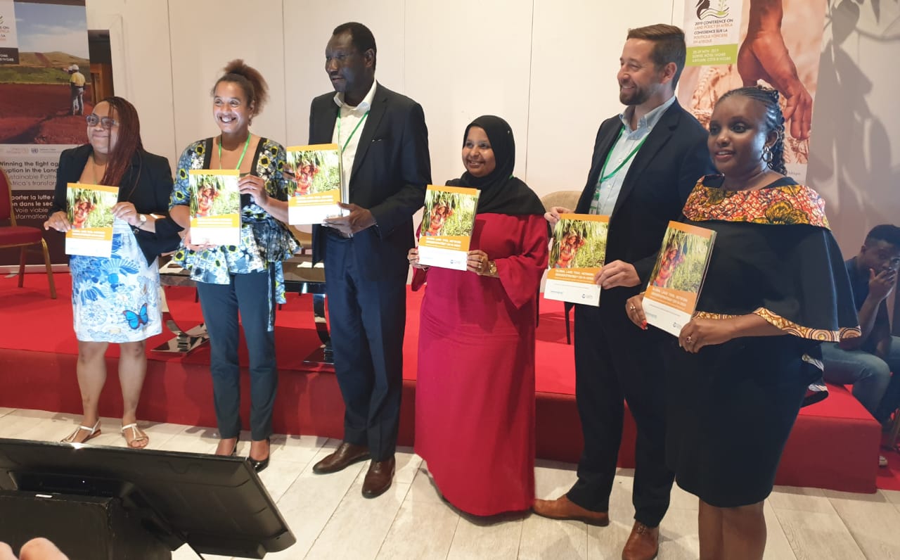 Land and GLTN Unit Leader Oumar Sylla (third from left) displaying copies of the GLTN Gender Strategy (2019-2030) with some of the GLTN partners who participated at the launch.