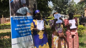 Three of the over 500 Mbale residents who received certificates of customary ownership Photo: ACTogether Uganda