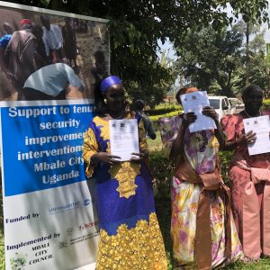 Three of the over 500 Mbale residents who received certificates of customary ownership Photo: ACTogether Uganda